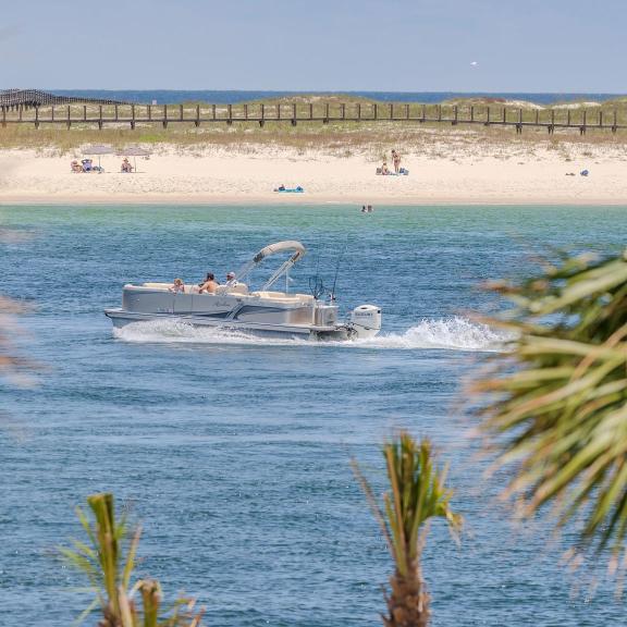 Pontoon boat cruising in the Gulf in Orange Beach